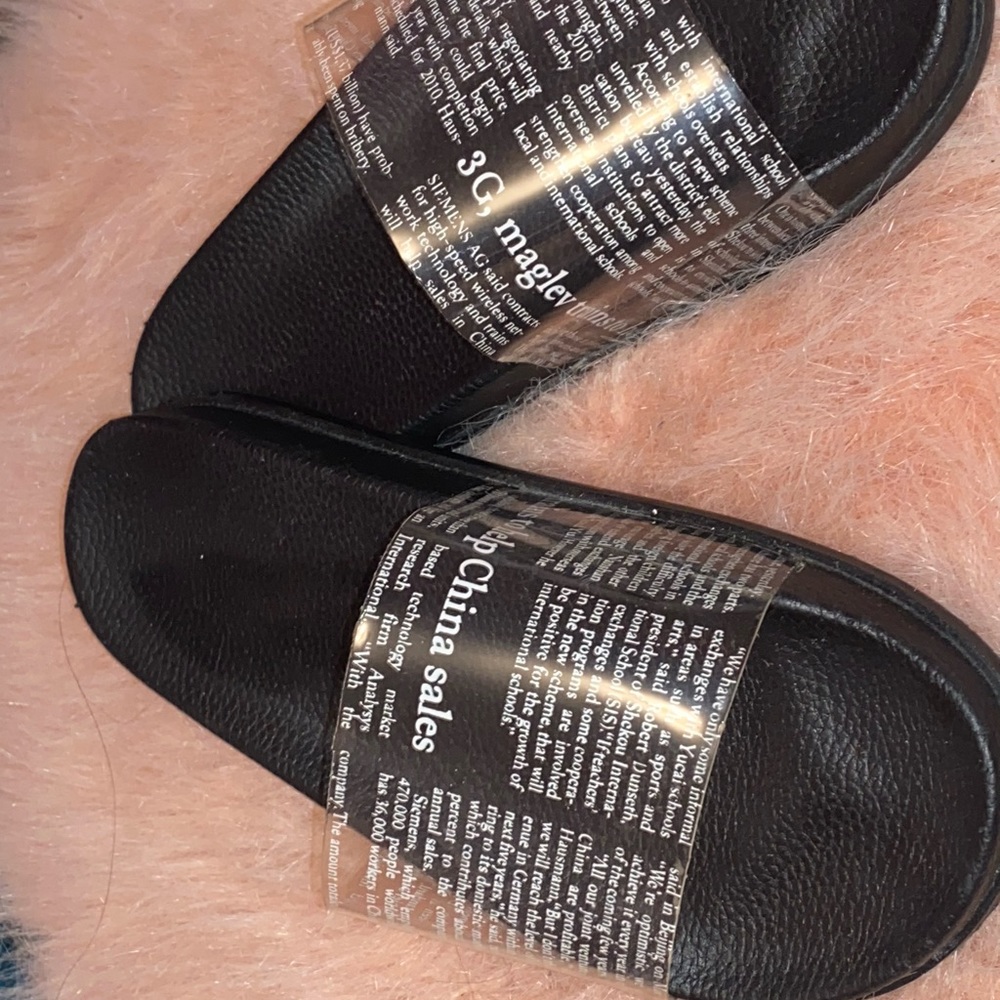 Clear Slides With Newspaper Design print on them